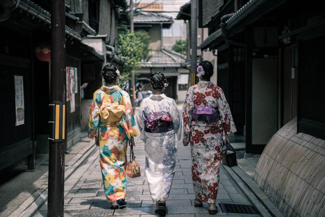 Women wearing kimonos which are wearing traditional clothes