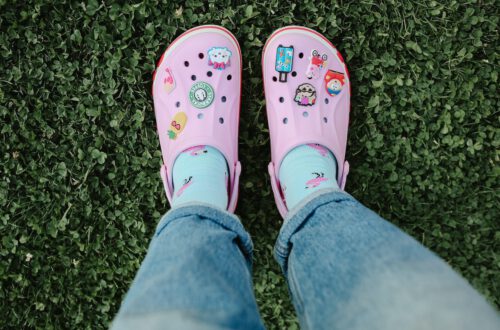 Stylish pink crocs on a women feet
